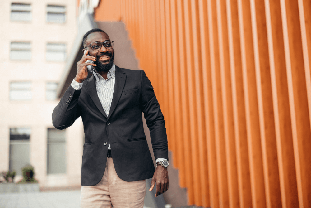 Image - Woman in orange top working in market/retail setting