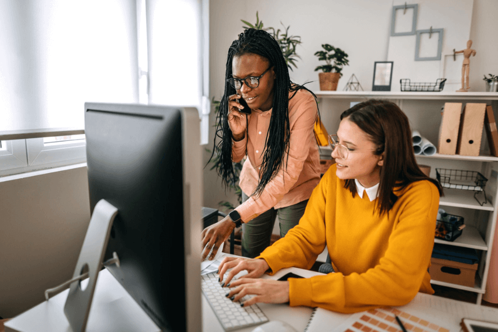Image - Business person in suit smiling in office
