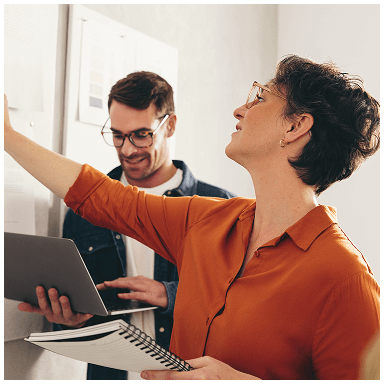 Two professionals reviewing documents together
